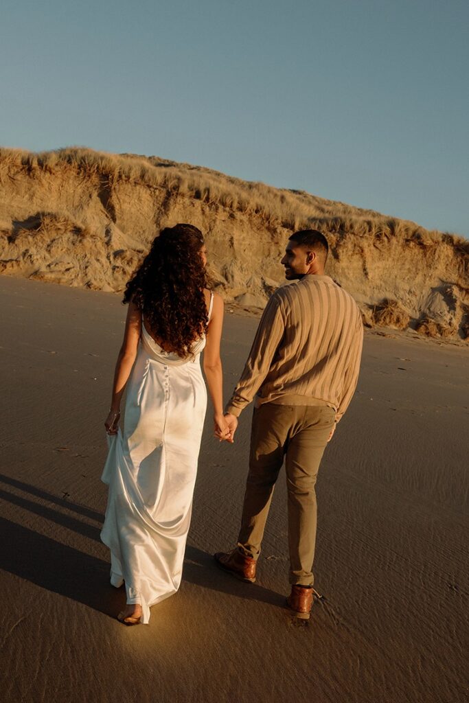 couples strolling on the beach during point reyes wedding photoshoot