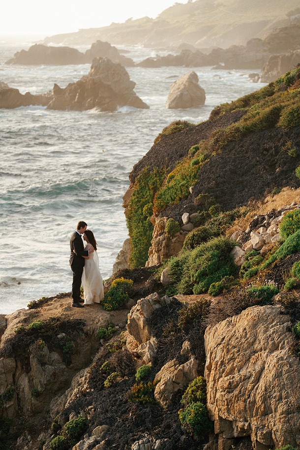 Couple walking along coastal trail during Big Sur elopement