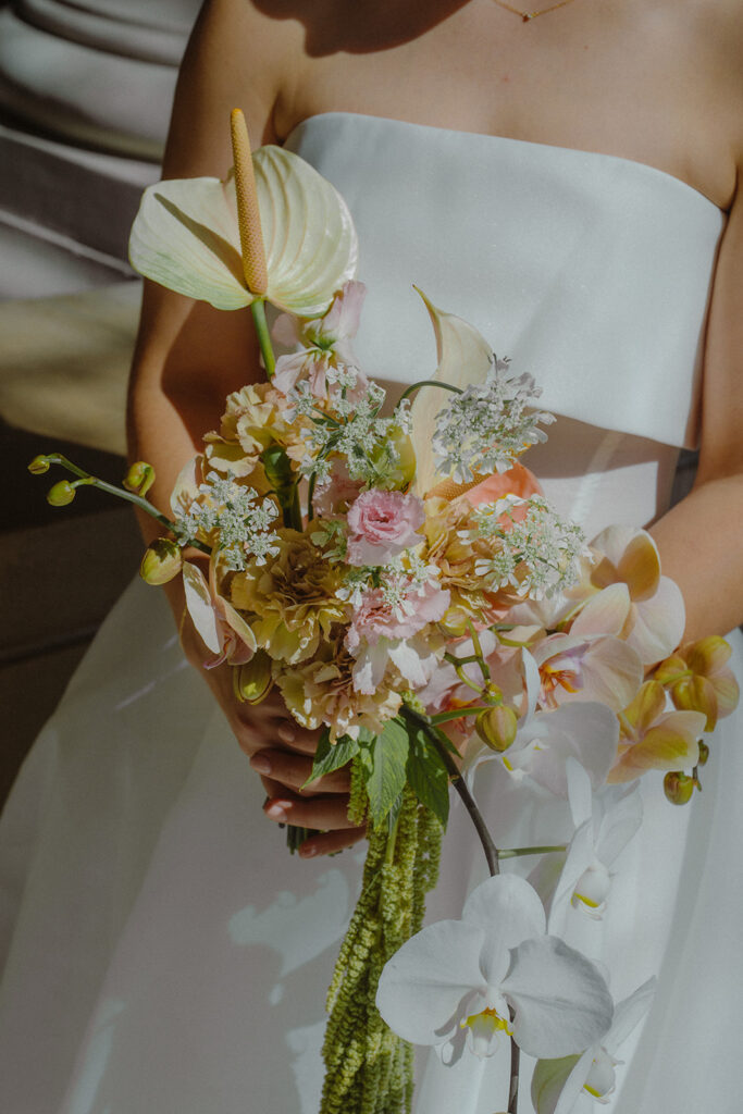 Bridal bouquet details during a wedding for couples eloping in San Francisco City Hall. 