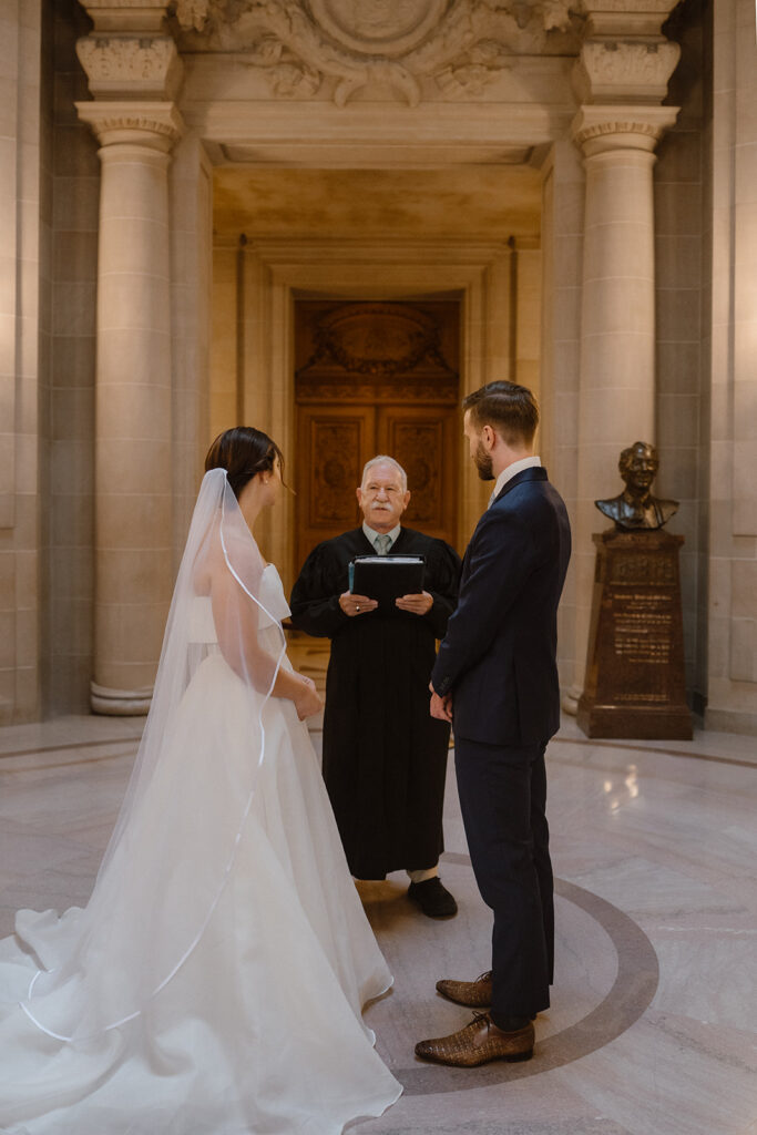 San Francisco City Hall elopement photographer documenting a civil ceremony beneath the Rotunda.