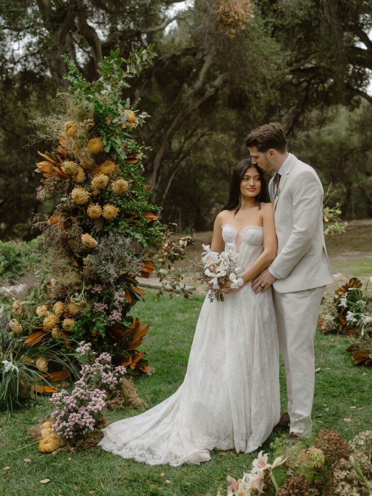 Couple sharing a quiet moment at one of the most beautiful San Francisco Bay Area intimate wedding venues with elegant outdoor ceremony styling.