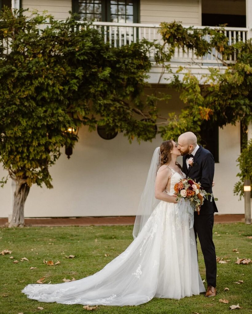 Newlyweds sharing a quiet moment at a small San Francisco wedding venue surrounded by historic architecture and peaceful garden grounds.
