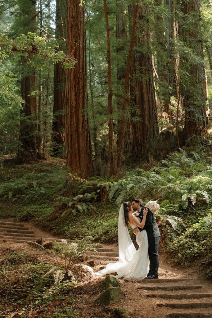 Bride and groom kissing at their intimate wedding in Muir Woods