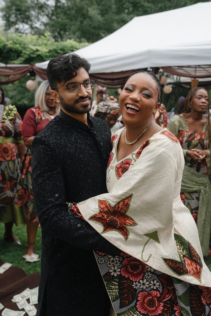A bride and groom celebrate after saying I Do in front of their friends and family