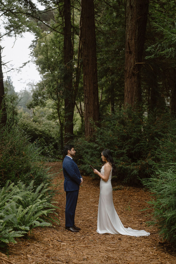 bride and groom reading vows to each other an an intimate wedding location in San Francisco, Golden Gate Park