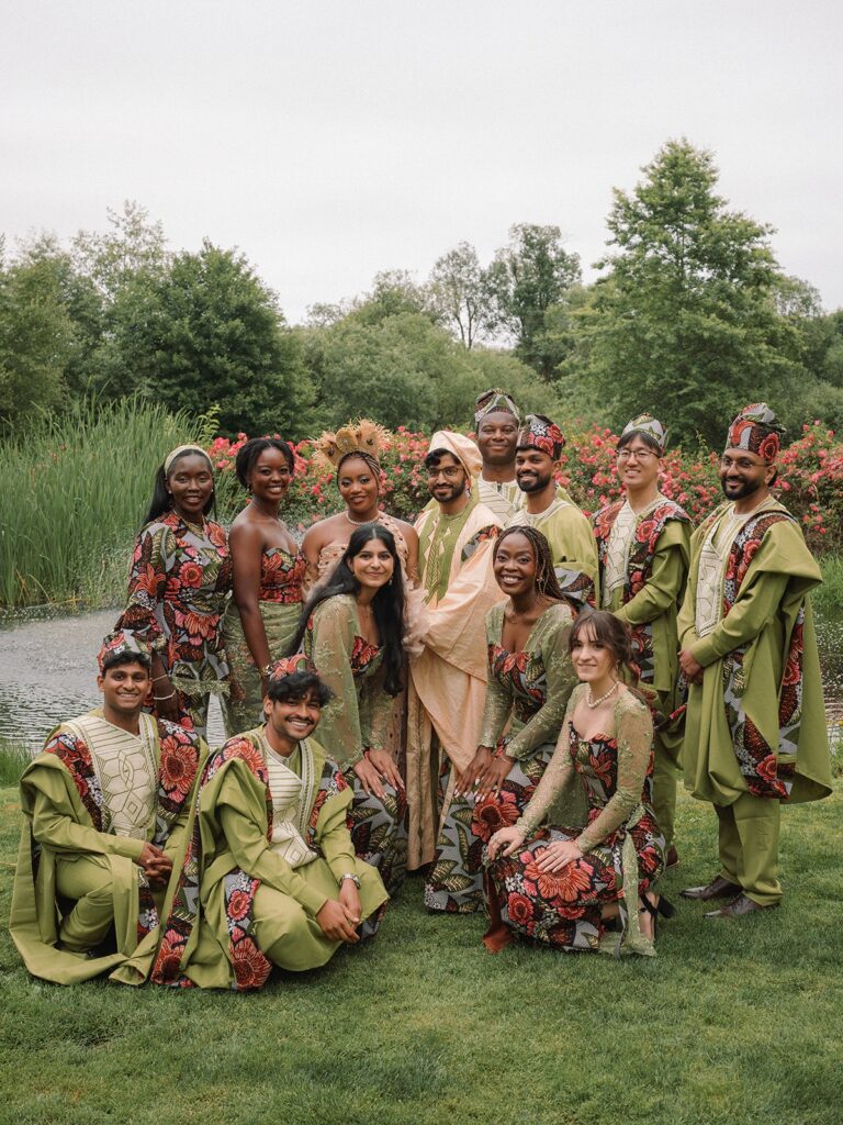 A bridal party wears traditional outfits for their Indian and Cameroonian wedding