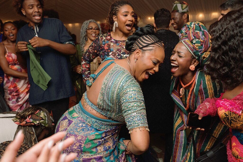 Woman dance and celebrate as their family enjoys a wedding in Seattle